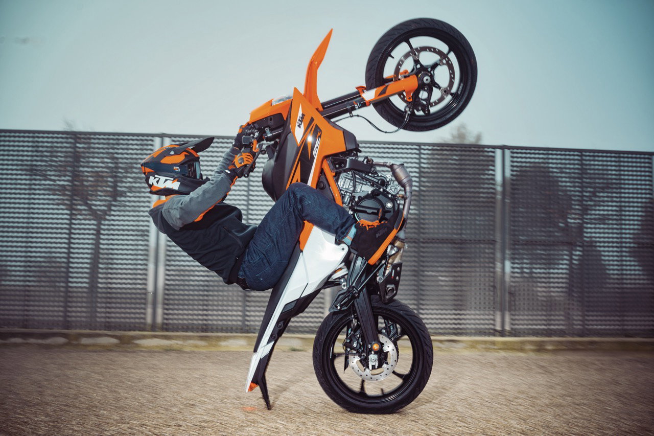 The 2025 KTM 125 SMC R pulling a wheelie